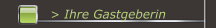 > Ihre Gastgeberin